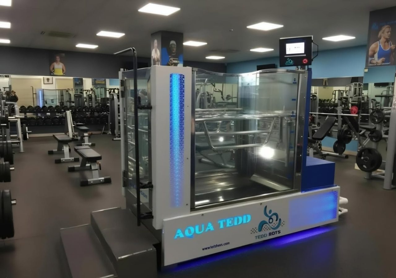AQUA TEDD underwater treadmill installed in a sports academy gym for athletic training and recovery