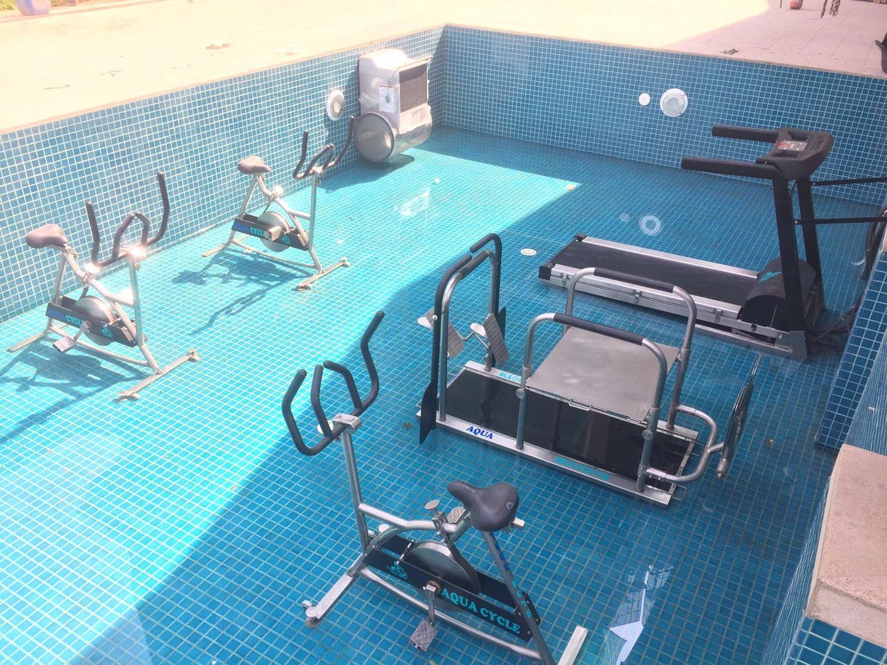 Aqua-fitness pool fit-out with underwater treadmill, aqua cycles and aqua gym for a wellness development